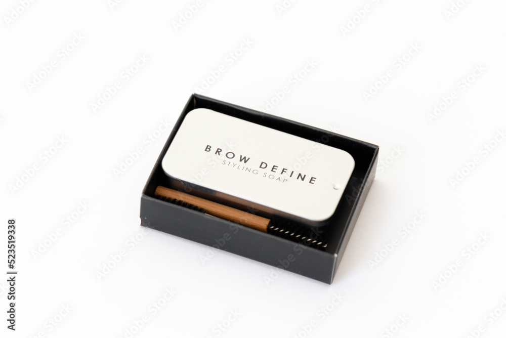 Bamboo brow brush and brow styling soap in a metal box. Cosmetic set