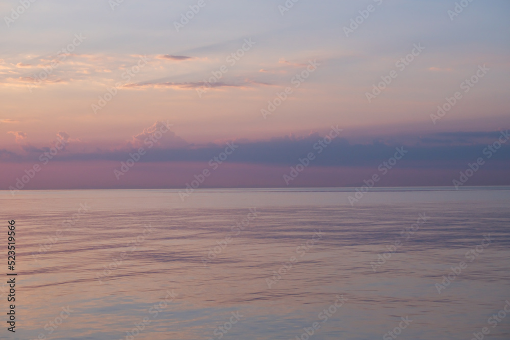 Blurred background sea and sky at sunrise.