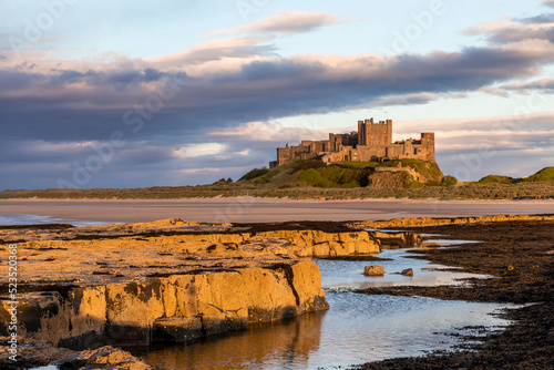 Bamburgh Castle from Harkness Rocks sunset photo