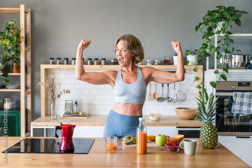 Wall Mural Beautiful mature senior woman at home - Cheerful active mature female person doi