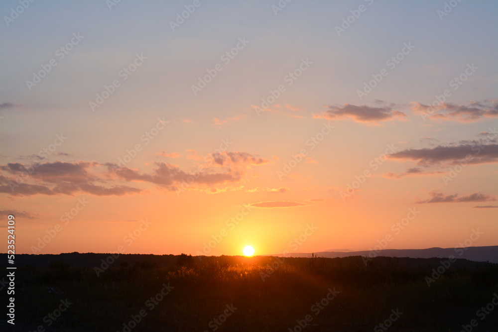 Picturesque view of beautiful field at sunset Picturesque view of beautiful field at sunset