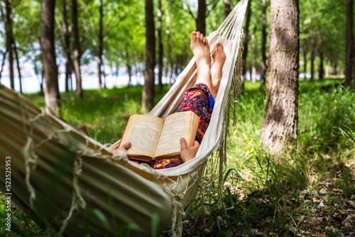 Fototapeta Naklejka Na Ścianę i Meble -  Women reading in forest
