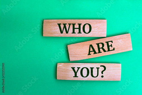 Photos Wooden blocks with words 'Who are you?'.