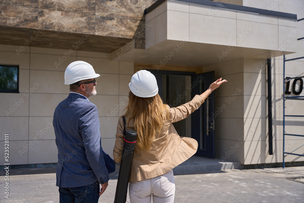 Realtor woman shows the client new house Realtor woman shows the client new house
