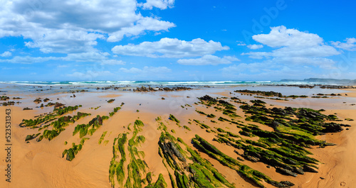 Rock formations on sandy beach (Portugal).