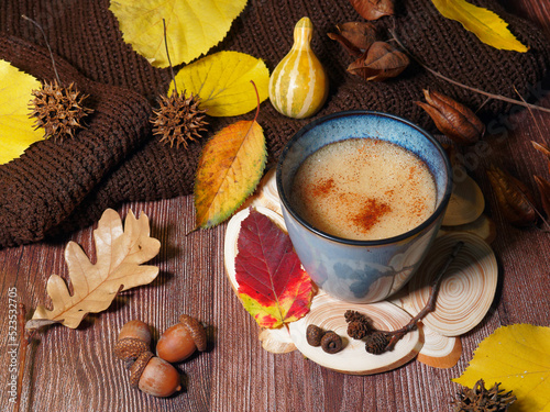 cup of coffee and autumn leaves