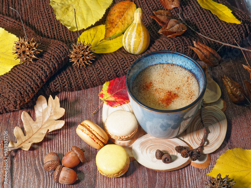 autumn still life with cup of coffee and macaroons