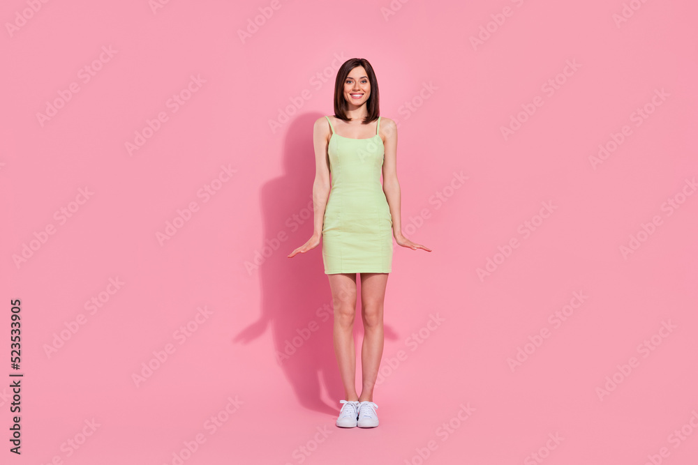 Full length photo of pretty lady skinny shape arm palm near leg stand show trendy summer outfit isolated on pink color background Full length photo of pretty lady skinny shape arm palm near leg stand show trendy summer outfit isolated on pink color background