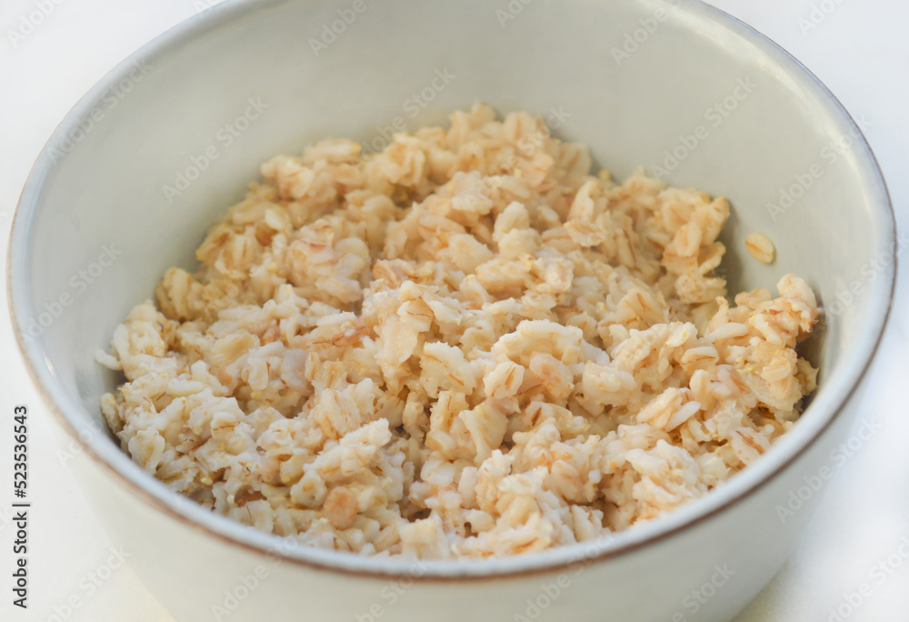 A bowl with oatmeal with the selective focus. Good for any project. A bowl with oatmeal with the selective focus. Good for any project.