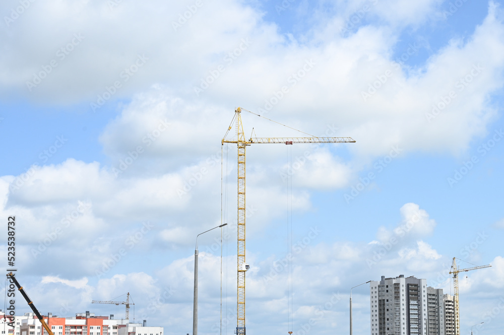 Construction site with many tower cranes. Construction an new apartment building. Construction site with many tower cranes. Construction an new apartment building.