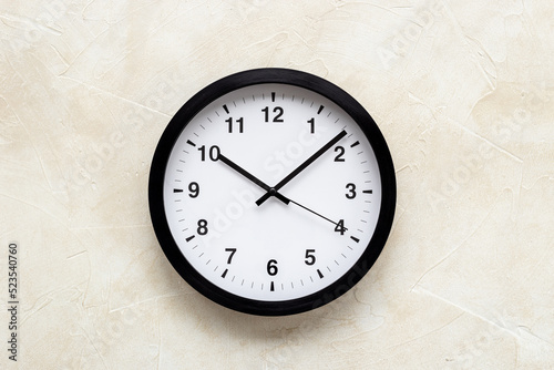 Round wall black and white clock. Time to work or rest concept