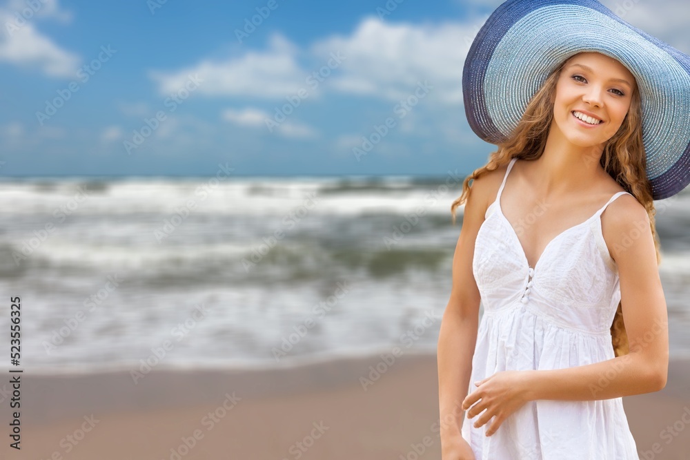 Young happy woman enjoying the resort on the beach Young happy woman enjoying the resort on the beach
