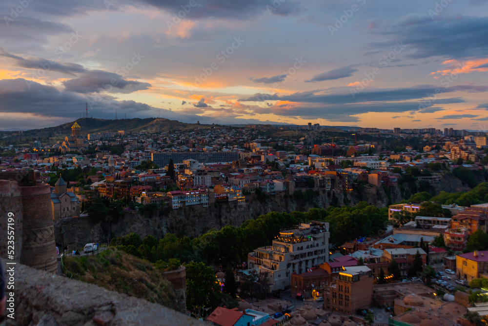 TBILISI, GEORGIA: Top view of the city of Tbilisi at sunset