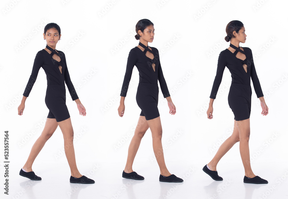 Full length person of young adult tanned skin woman walk front left right turn with confident and happy. Asian Female smile cheerful in black dress over white background isolated Full length person of young adult tanned skin woman walk front left right turn with confident and happy. Asian Female smile cheerful in black dress over white background isolated