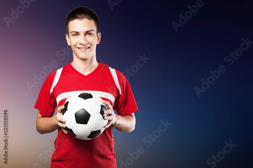 Young fun fan man cheer up support football sport team hold in hand soccer ball