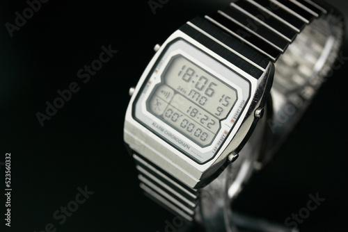 digital watch silver vintage retro wristwatch 70s 80s isolated alarm multifunctional chronograph scratched steel used made in japan rare worn on watch stand Armbanduhr chronograph side view closeup