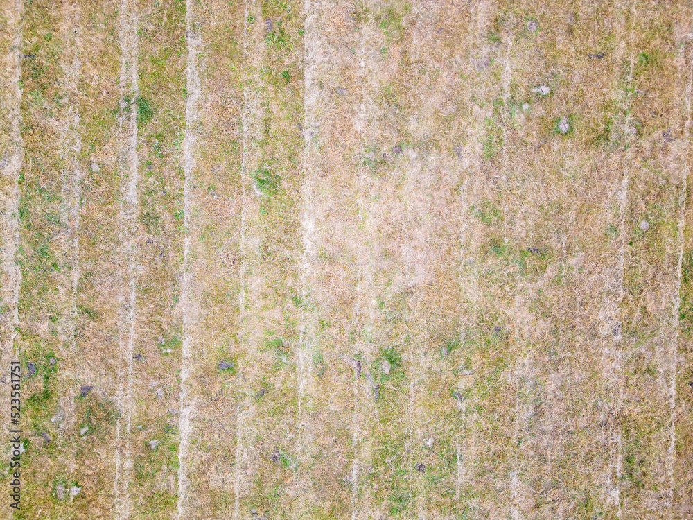Aerial view shot from a drone above agricultural farmland during heatwave of 2022 as drought hits North Yorkshire. Dry and barren fields used for livestock farming. Aerial view shot from a drone above agricultural farmland during heatwave of 2022 as drought hits North Yorkshire. Dry and barren fields used for livestock farming.