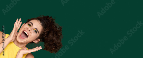 Konstfotografi surprised woman in yellow dress starring with opened mouth