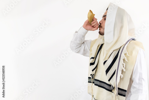 Orthodox Jewish man blast in Shofar at Rosh Hashana holiday photo