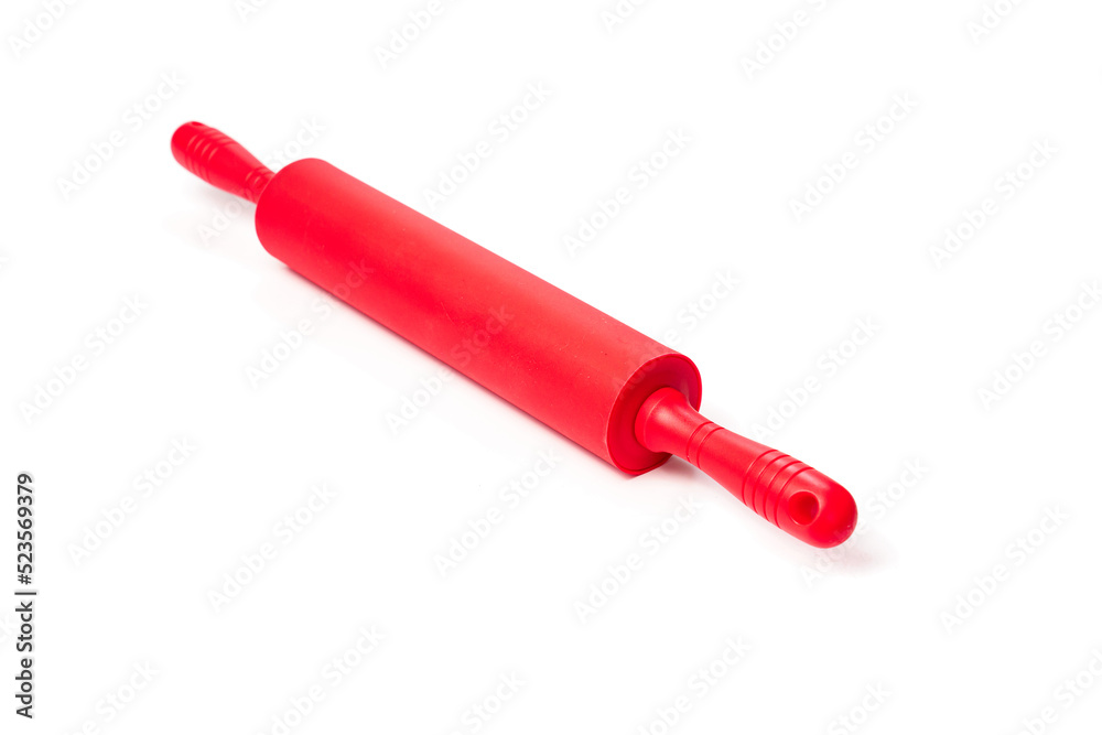 red rolling pin with silicone coating for rolling dough on a white background. red rolling pin with silicone coating for rolling dough on a white background.