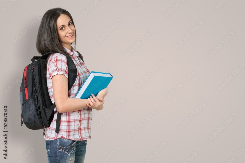 Student girl holding open book on the background. Student girl holding open book on the background.