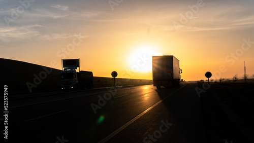Vehicles exporting at sunrise view