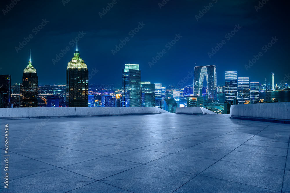 Empty floor and city skyline with modern building in Suzhou at night, China. Empty floor and city skyline with modern building in Suzhou at night, China.