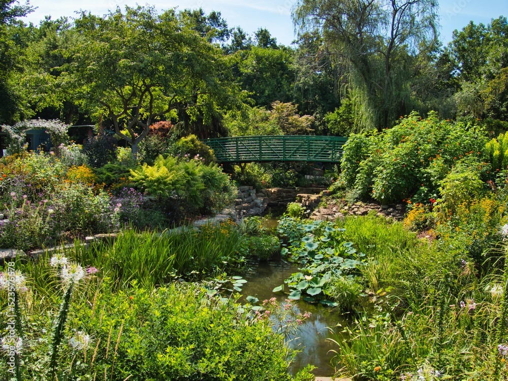 Green Bridge Crossing Beautiful Flower Garden