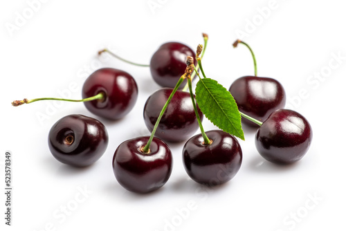 Sweet cherries with cherry leaf isolated on a white background.