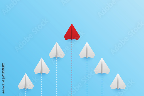 Paper plane on blue background, Business competition concept. leadership for new ideas competition. competitor individual pointing in different ways for new competitive solution.