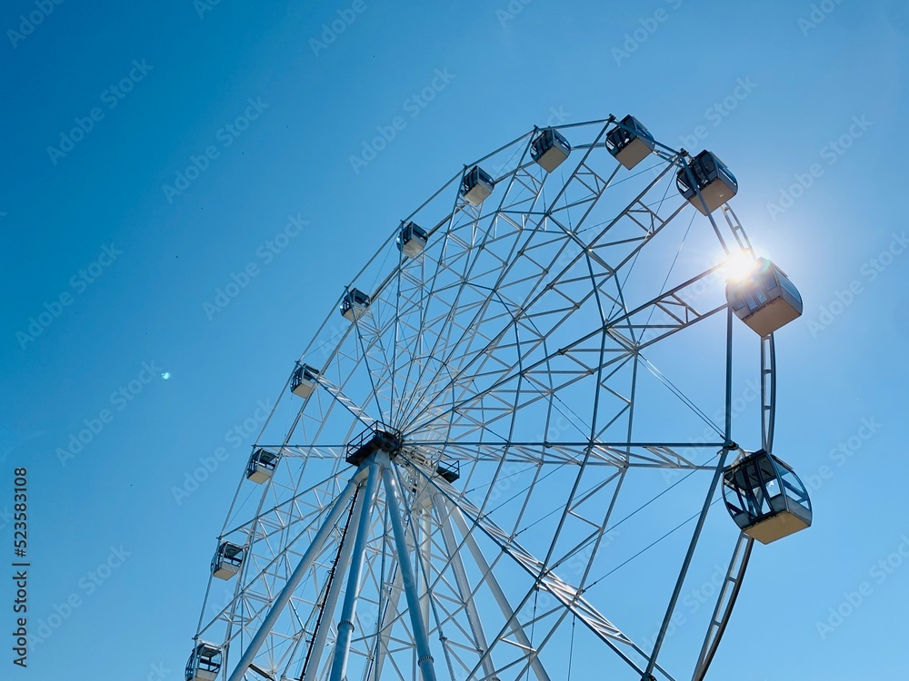 ferris wheel on a blue sky ferris wheel on a blue sky