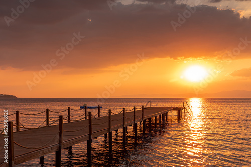 sunset pier in the sea 