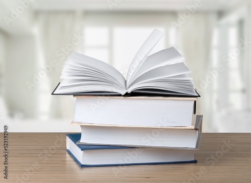 A simple composition of many books  stack or pile of books on wooden table concept