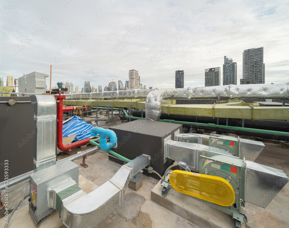 Chiller tower or cooling tower on rooftop of a office building in urban city. System work. Architecture machine. Condenser Water Supply and Condenser Water Return pipe lines. Ventilation compressor. Chiller tower or cooling tower on rooftop of a office building in urban city. System work. Architecture machine. Condenser Water Supply and Condenser Water Return pipe lines. Ventilation compressor.