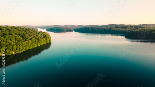 Aerial Photo of a large river surrounded by lush forests in New York. 