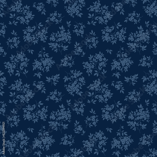 Vintage floral background. Floral pattern with flowers drawn in blue silhouette on a dark blue background. Seamless pattern for design and fashion prints. Liberty style. Stock vector illustration.