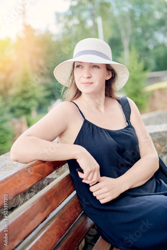 Close-up Fashion woman portrait of young pretty trendy girl in hat posing at the city, summer street fashion. trendy
