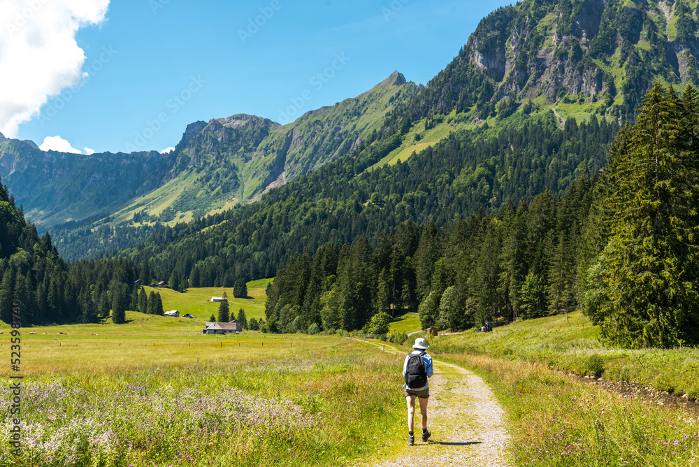 Hiker walking in the obersee region in Glarus, Switzerland
