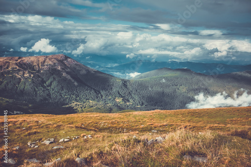 Morning autumn scene from mountain top aerial view. Nature landscape. Amazing summer scenery. Natural background. Travel, trekking in Carpathian mountains, Ukraine, Europe. Vintage retro tone filter