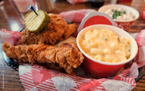 Fried chicken tenders with a side of macaroni and cheese