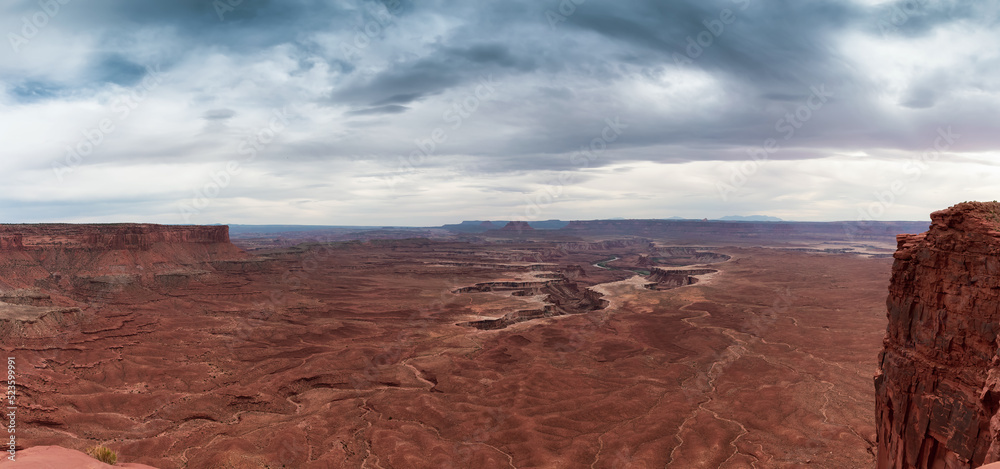 Scenic Panoramic View of American Landscape and Red Rock Mountains in Desert Canyon. Colorful Sky. Canyonlands National Park. Utah, United States. Nature Background Panorama Scenic Panoramic View of American Landscape and Red Rock Mountains in Desert Canyon. Colorful Sky. Canyonlands National Park. Utah, United States. Nature Background Panorama