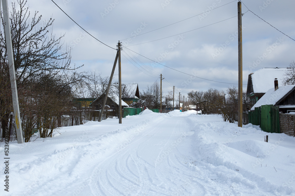 Empty snow covered road in winter landscape Empty snow covered road in winter landscape