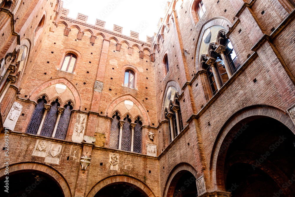 Interior courtyard of the city hall (in italian: Palazzo Comunale or Palazzo Pubblico) in Siena, Tuscany, Italy, Europe