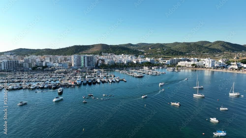 Marina full of boats and yachts, in front of a coastal city. Marina full of boats and yachts, in front of a coastal city.