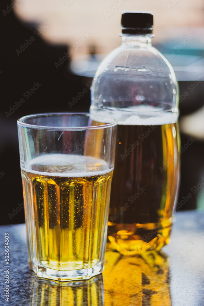 Beer glass and beer bottle. Cold alcohol drinks. Pub concept. Gold colored beer on table. Oktoberfest concept. Icy beer. Summer refreshment. Bar concept. Beer glass and beer bottle. Cold alcohol drinks. Pub concept. Gold colored beer on table. Oktoberfest concept. Icy beer. Summer refreshment. Bar concept.