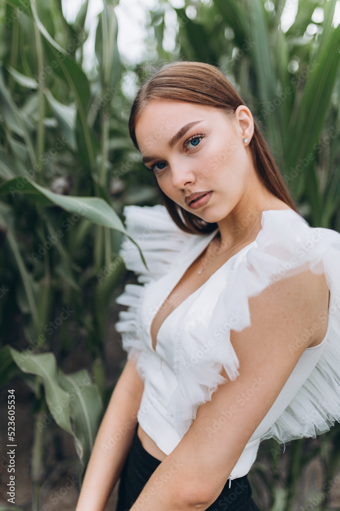 Outdoor woman portrait in green field. Fashion young caucasian beauty girl Outdoor woman portrait in green field. Fashion young caucasian beauty girl