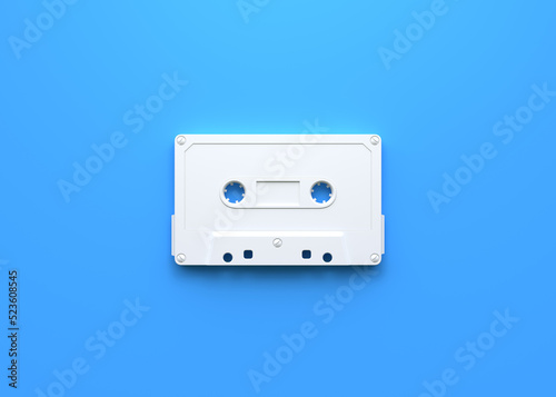 Vintage audio tape cassette on a blue background. Top view with copy space. 3d rendering illustration