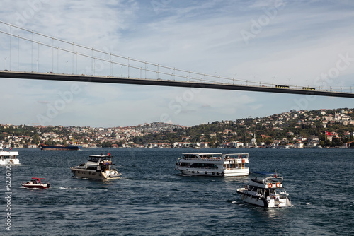 Canvas Print View of cruise tour boats on Bosphorus and bridge in Istanbul
