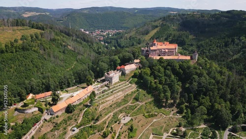 Aerial drone fly near the Pernstejn castle, Czech Republic. Vysocina region near the Nedvedice village. Summer day with sun and blue sky. Green nature and fresh forest. photo