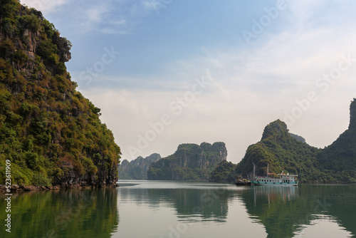 Boat at anchor by Hon Vit Con  Duckling Rock   Halong Bay  a popular travel and tourism destination in Quang Ninh Province  Vietnam